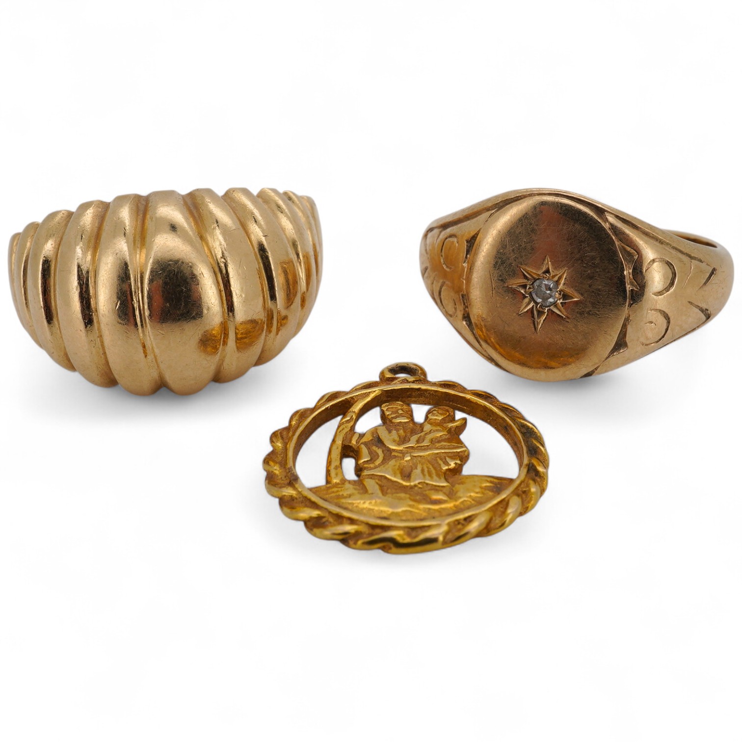 A 9ct gold and diamond set signet ring, size M/N, a fluted 9ct gold ring and a 9ct gold St. Christopher's charm, gross weight 13.2 grams.
